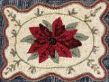 Poinsettia.Designed by Old Tattered Flag,Hooked by Joyce Combs (2022)